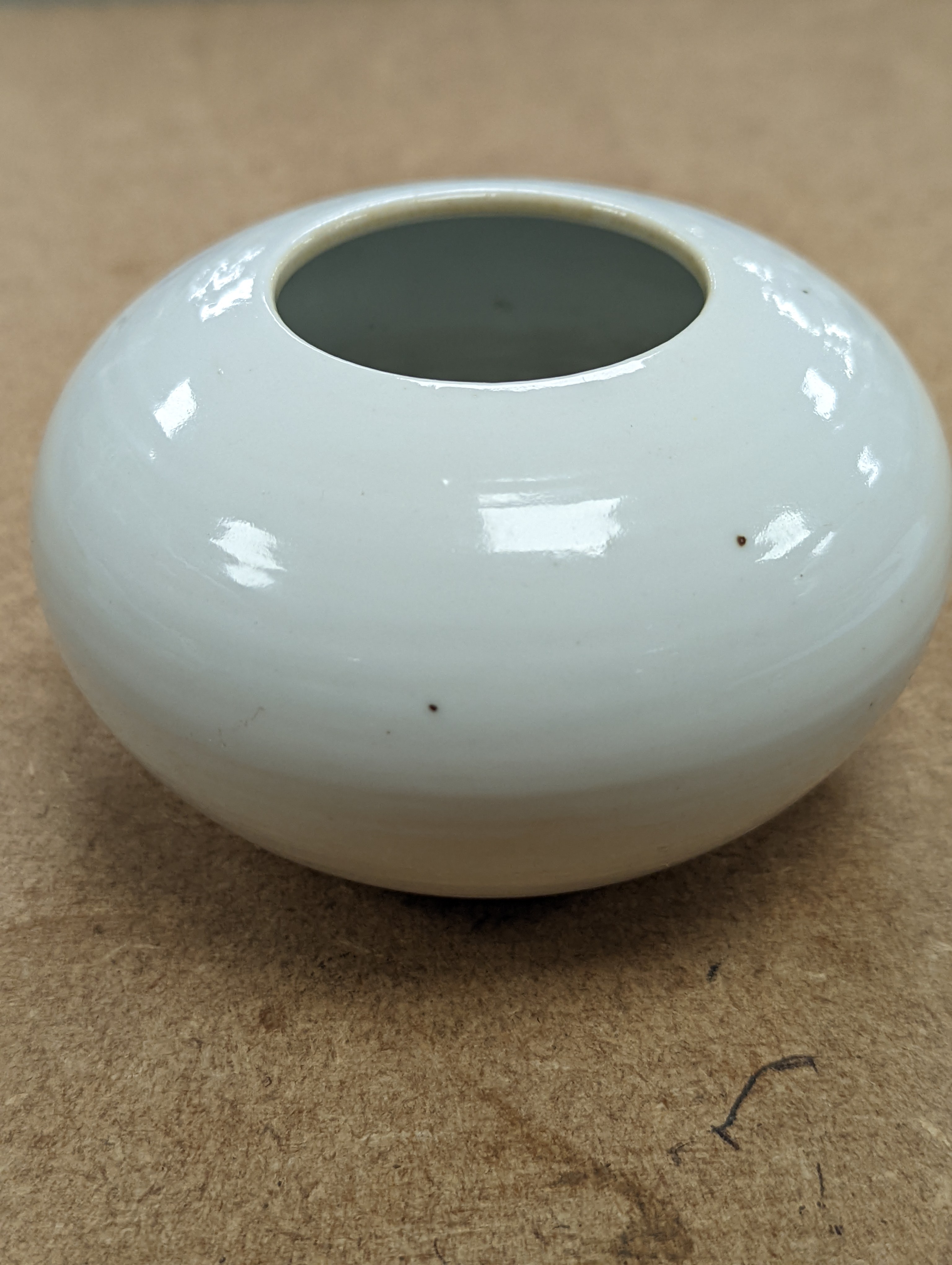 A Chinese white glazed water pot and a similar cup (2)